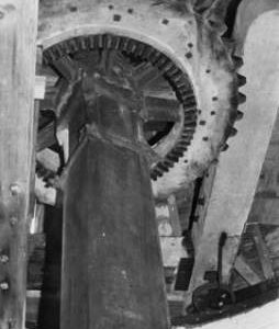 Underside of wallower and wooden upright shaft