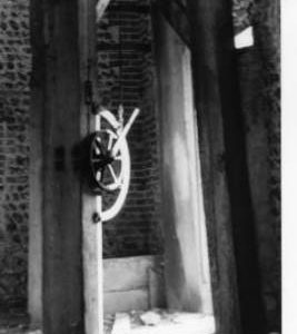 Derelict windwheel: gearing inside barn