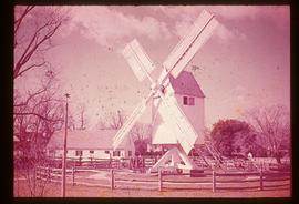 Preserved open-trestle post mll (possibly model) with sails