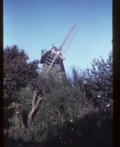 House conversion with two sails, partly obscured by trees, Meeten's Mill, West Chiltington