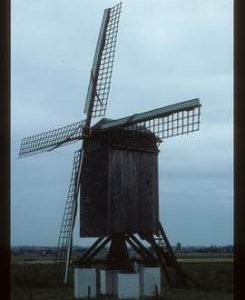 Preserved open-trestle post mill with sails