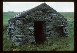 Small unidentified stone building, presumably watermill, in coastal setting