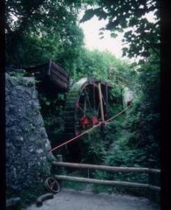 Exterior view of preserved standalone(?) Waterwheel driving linear shaft