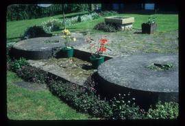 Pair of edge runner stones as garden ornaments, Peppering Eye Mill, Catsfield