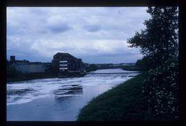 Large brick watermill building, evidently still used as business