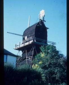 Hogg Hill Mill, Icklesham, scaffolded for repair with stocks and rooftop fantail