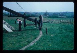 James Waterfield turning winch on tailpole to wind preserved post mill