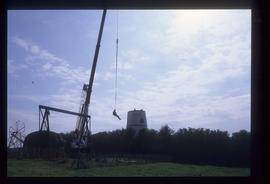 Man being lifted up by crane, Waterhall Mill, Patcham