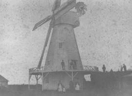 Smock mill, Aldington, with miller and family