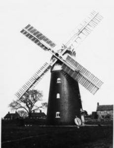 Tower mill, Barnham, with Millstone