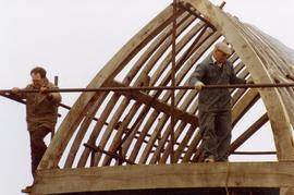 Two volunteers working on buck scaffolding, post mill, Chinnor