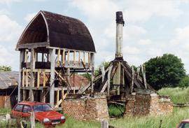 Trestle with buck shown under construction at ground level, post mill, Chinnor
