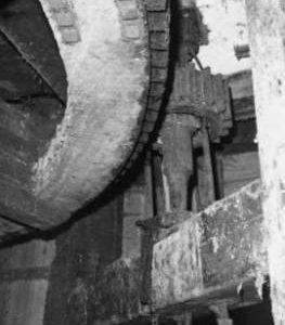 Spur wheel, stone nut and bridge tree, Burcombe Mill, South Newton