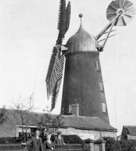 Misterton tower mill with the miller and his wife