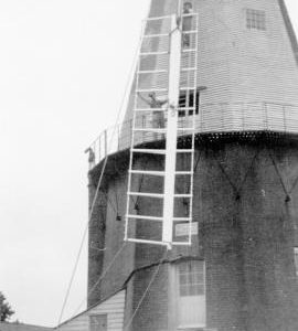 Raising a new sail during restoration, Union Mill, Cranbrook