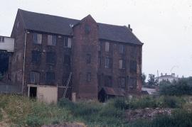 Peel Mill, Winshill - "biscuit (tape) factory", tail side, turbine house on left, showing built-out staircase