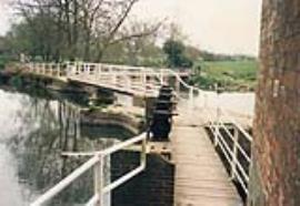 Sturminister Newton Mill, Dorset, Grade II, sluice gates by weir