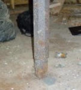 Detail of upright shaft on stone floor, smock mill, Crowfield