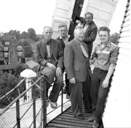 "C Bremer (centre his brother (seated, with clogs) & men"