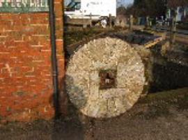 Bishop's Offley Mill, Offleybrook - bedstone with radial burrs (outside mill)
