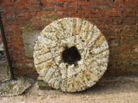 Bishop's Offley Mill, Offleybrook - runner stone with radial burrs (outside mill)