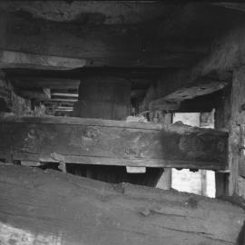 King's Bromley Flour Mill, King's Bromley - bridge tree, upright shaft, wallower, seen through window in the front of the mill