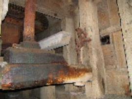 Stramshall Mill, Stramshall - one of the bridge trees and stone spindles, with base of upright shaft, and the "wallower"