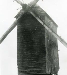 Close up of sails on unknown post mill with trestle, France