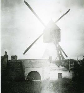 Unknown cavier mill (a type of hollow post mill), France, showing Berton Sails, wooden housing and surroundings