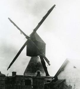 Unknown cavier mill (a type of hollow post mill), France, showing Berton Sails, wooden housing and surroundings