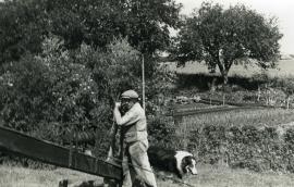 Photograph of miller and dog, most likely at Moulin de Saint-Maxent, Somme, France