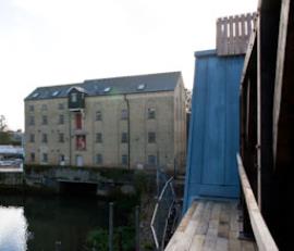 Viewing window between old mill interpretation and old mill at work, Holme Mills, Holme