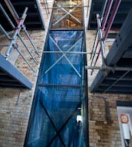 Viewing window between old mill interpretation and old mill at work, Holme Mills, Holme