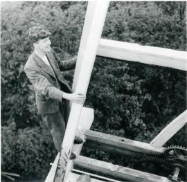 Chris Wilson climbing a fan frame