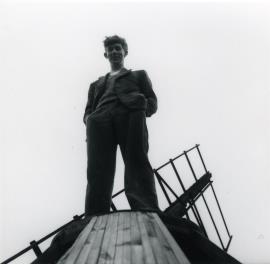 Chris Wilson standing atop Tower mill, Over's cap