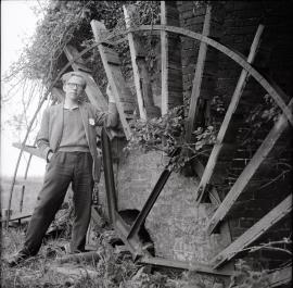 Tunstall Dyke Tower Mill, Tunstall - Stephen Buckland next to the scoop wheel