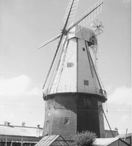 View of mill and surrounding buildings and car, Union Mill, Cranbrook