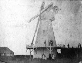 Smock mill, Aldington, with cottage and group