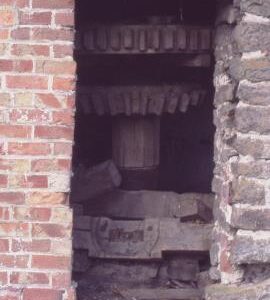 Stockton Mill, Stockton, Chirbury with Brompton - wooden wallower and great spur wheel seen from outside