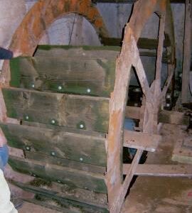 Wickhamford Mill, Wickhamford - the waterwheel in the course of being re-bucketed by members of Midland Mills Group, showing a couple of the old sole boards